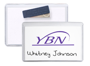 Magnetic fastener attached to the back of plastic badge holder. The badge has a white cardstock insert with a purple logo and printed name.