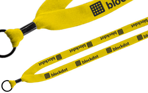 Silk screen text and logo and a 3/4 cotton lanyard with a crimp finish.