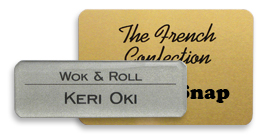 metal name tags used for customer service in a food service business