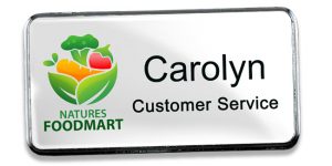UV color printed logo name tag with a dome and a frame to show how a premium name tag can upgrade an employee uniform.