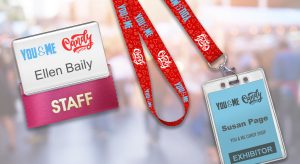 A reusable badge, lanyard, badge holder and badge ribbon all designed to promote one event.