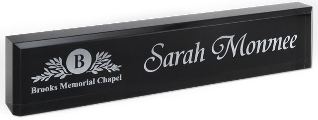 2x10 black acrylic name plates, text and logo engraved on the front.