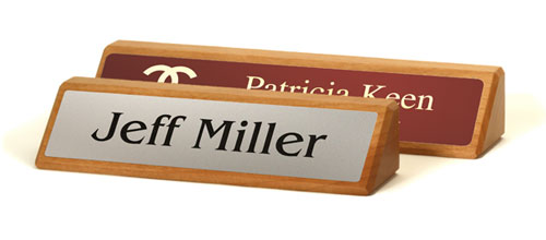 Two red alder executive name plates, 8.5x2 and 10.5x2 inches.