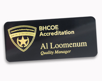 1.5x3.5 metal name tag with text and engraved logo