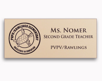 Brown text and logo engraved into a ivory name tag.