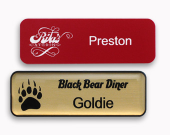 Examples of two laser engraved name tags with logos