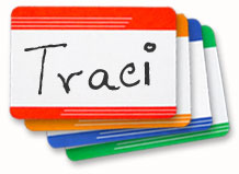 Adhesive name badges in four colors: red, yellow, blue and green with a handwritten name.