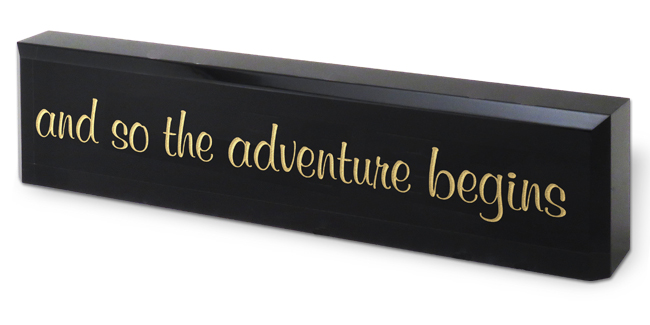 Black Acrylic Desk Block with engraved text to be used as a graduation award.