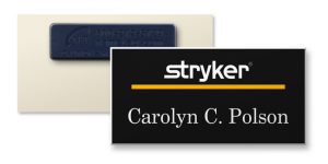 A full color name tag with someone's first and last name as well as a deluxe magnetic fastener.