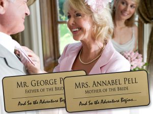 Euro gold plastic name tags with black engraving showing mother and father of the bride names and titles for spring and summer weddings.