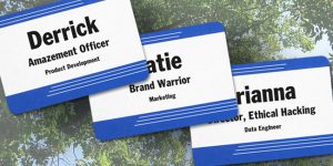 Adhesive name badges printed with fun titles for a corporate summer event.
