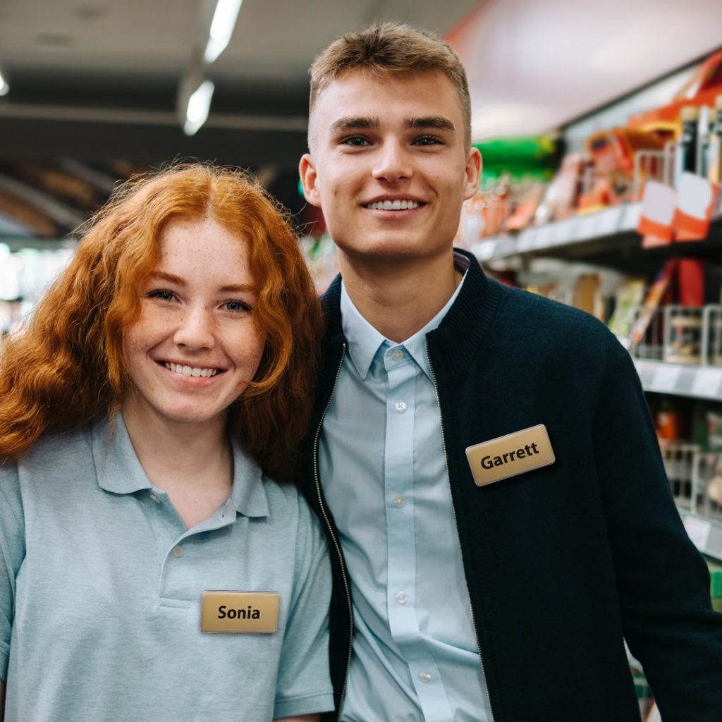 Retail workers wearing personal identification product reusable badges
